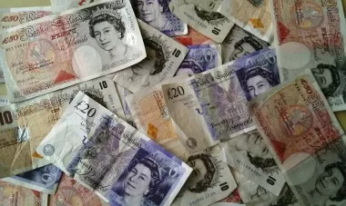 Pile of British banknotes including tens twenties and fifties
