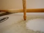 Drum skin close-up showing wear from playing