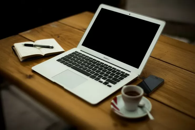 Home office desk setup with computer and paperwork