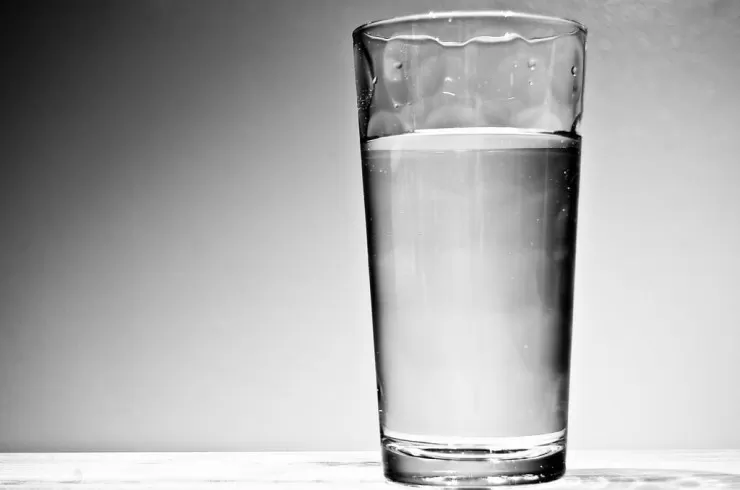 Glass of water for staying hydrated to protect your singing voice