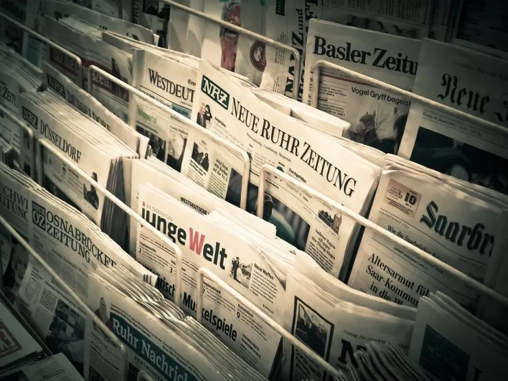 newspaper rack representing press quotes for a band biography