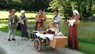 Medieval musicians in period costume performing outdoors