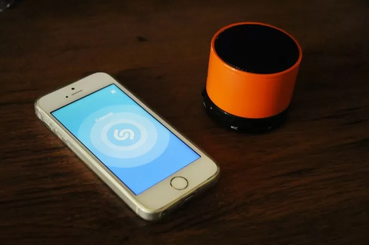 Musician using a smartphone with headphones