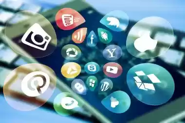 Social media and app icons floating over a smartphone