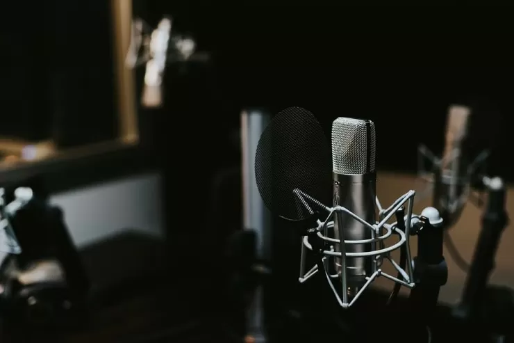 Professional recording studio with mixing desk and equipment