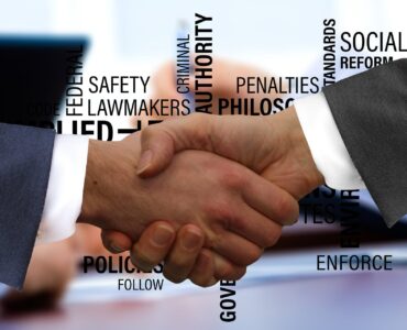 Musician and promoter signing a live gig contract