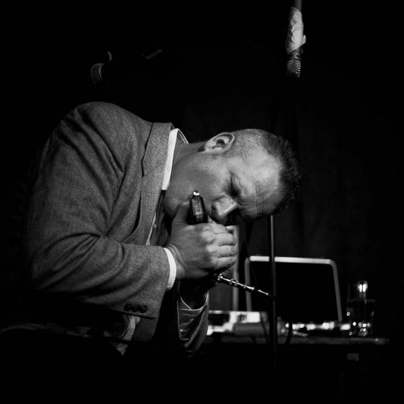 Mat Walklate playing the harmonica